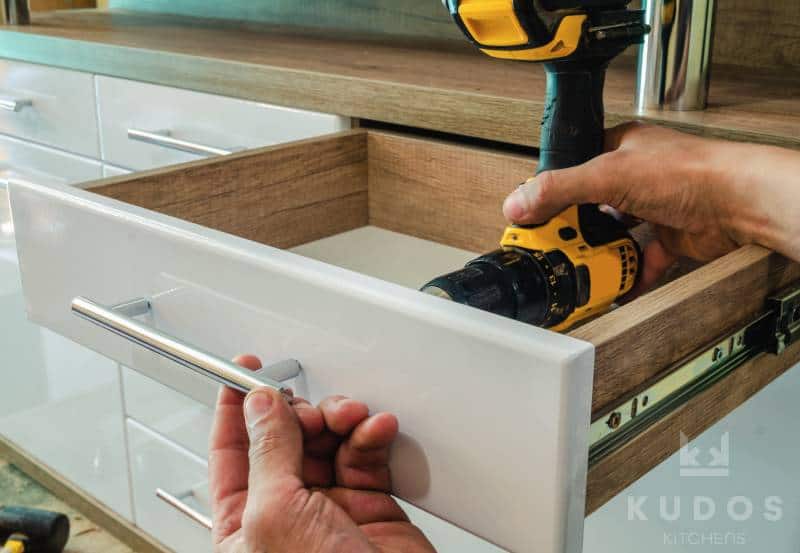 fixing handles to kitchen drawers