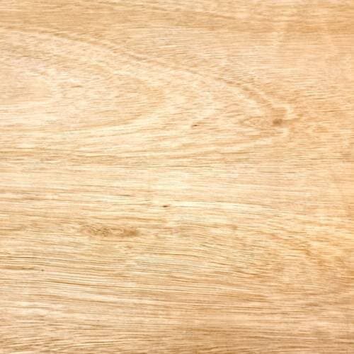 A close-up of a light wood surface showing its natural grain patterns.